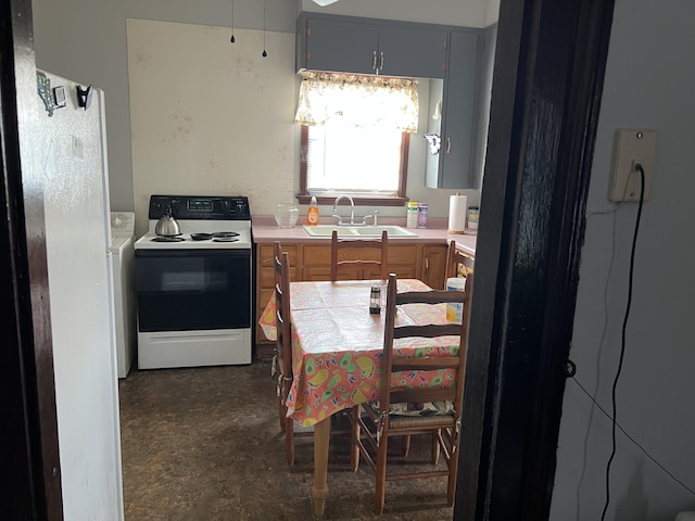 kitchen with sink, electric range oven, and gray cabinetry