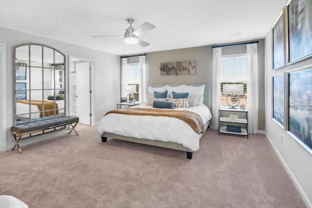 carpeted bedroom with ceiling fan