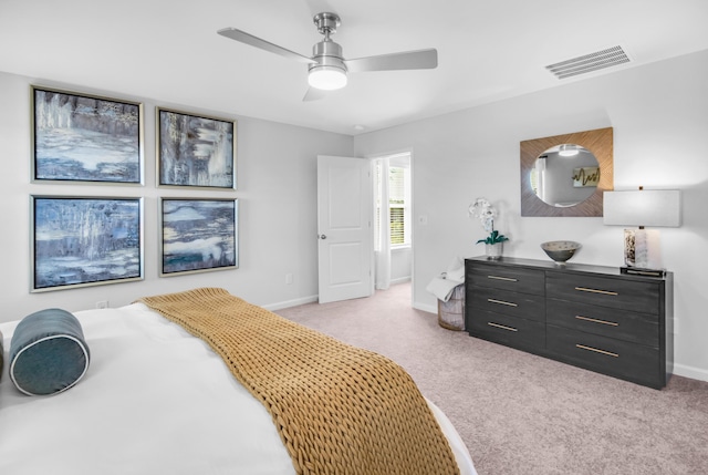 bedroom featuring ceiling fan and light carpet