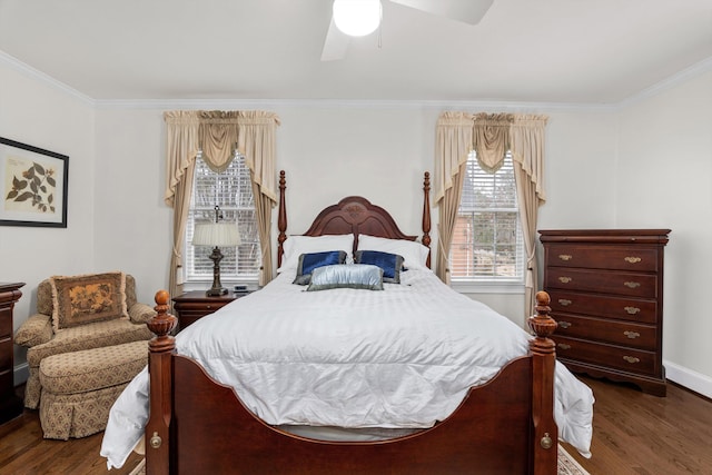 bedroom featuring crown molding, dark wood-type flooring, and ceiling fan