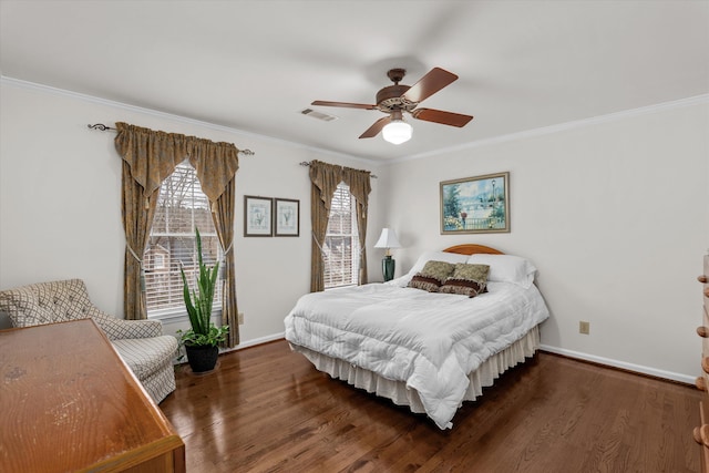 bedroom with crown molding, ceiling fan, and dark hardwood / wood-style flooring