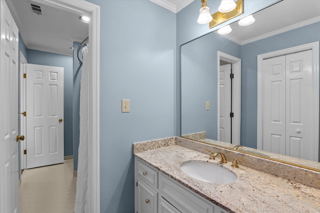 bathroom featuring vanity and ornamental molding