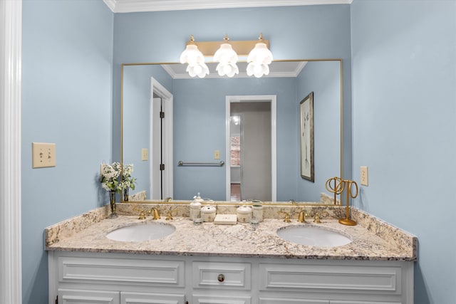 bathroom with ornamental molding and vanity