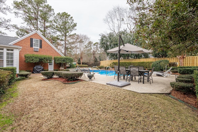 view of yard featuring a fenced in pool and a patio area