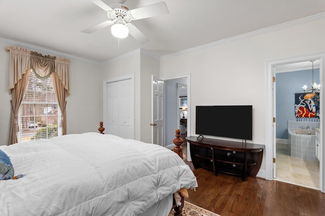 bedroom with dark wood-type flooring, ensuite bathroom, ornamental molding, ceiling fan with notable chandelier, and a closet