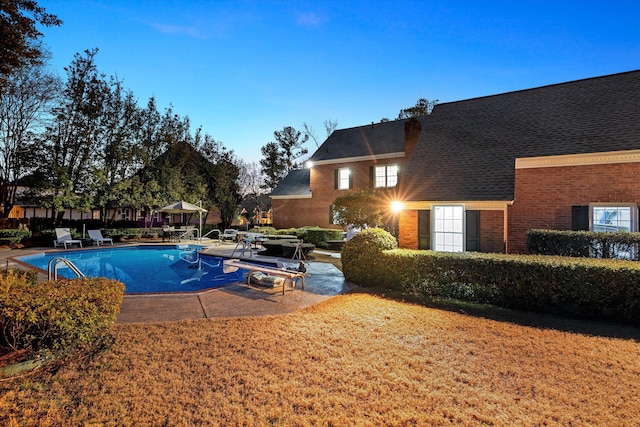 view of swimming pool featuring a patio