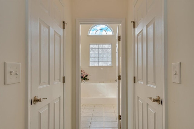 corridor with light tile patterned floors