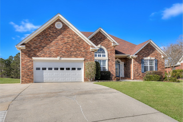 view of front of property with driveway, an attached garage, a front lawn, and brick siding