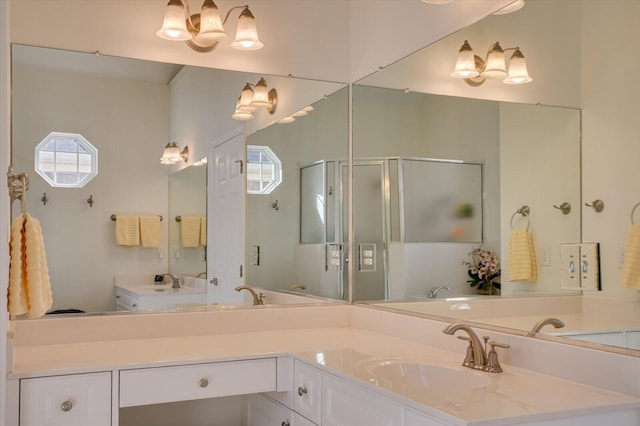 full bath with plenty of natural light, a shower stall, and vanity