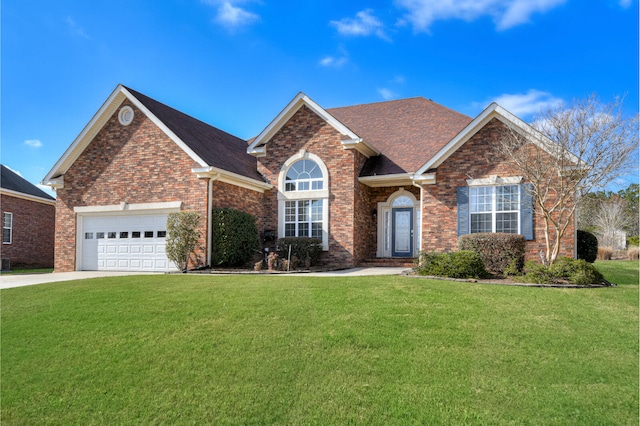 view of front of house featuring an attached garage, brick siding, driveway, roof with shingles, and a front yard