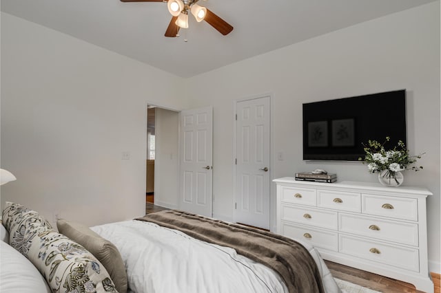 bedroom featuring ceiling fan and wood finished floors