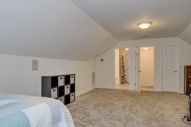 bedroom featuring lofted ceiling, visible vents, light carpet, and baseboards