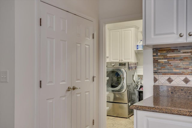 laundry area with cabinet space and separate washer and dryer