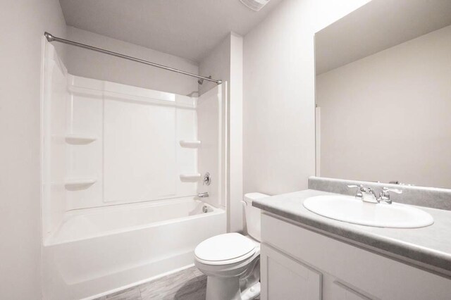 full bathroom featuring vanity, shower / tub combination, and toilet