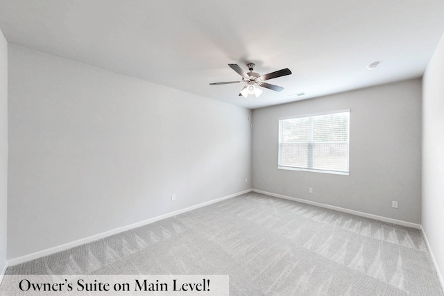 empty room with light colored carpet and ceiling fan