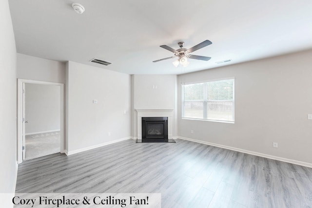 unfurnished living room featuring light hardwood / wood-style floors and ceiling fan