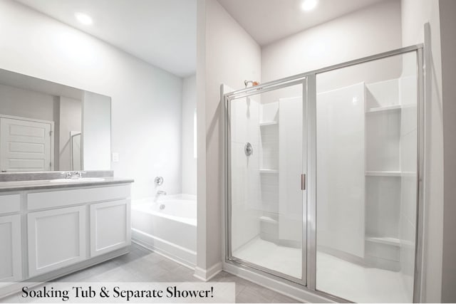 bathroom with vanity, tile patterned floors, and independent shower and bath