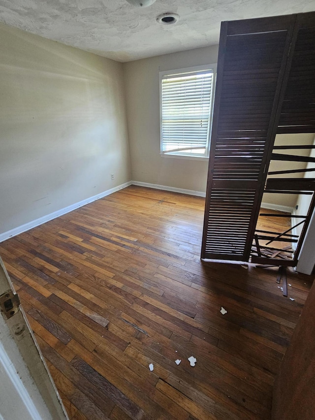 109 E E Walker St, Augusta, GA 30901 - spare room featuring hardwood / wood-style floors and a textured ceiling
