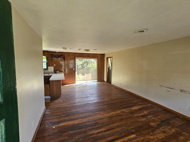 109 E E Walker St, Augusta, GA 30901 - unfurnished living room with dark wood-type flooring and baseboards