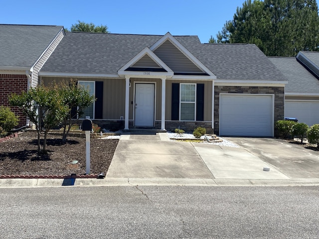 1908 Aspen Green Way, Augusta, GA 30909 - view of front of home with a shingled roof, an attached garage, and stone siding