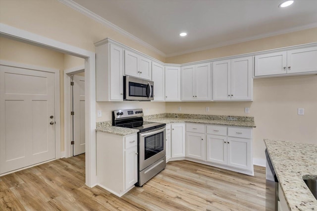 kitchen featuring light stone countertops, light wood-type flooring, ornamental molding, stainless steel appliances, and white cabinets