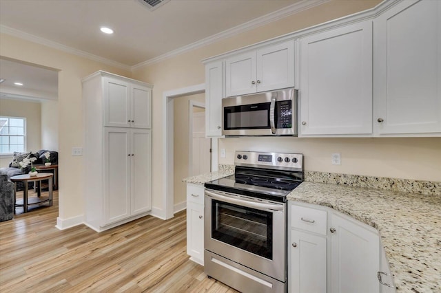 kitchen featuring light hardwood / wood-style floors, crown molding, white cabinetry, and stainless steel appliances