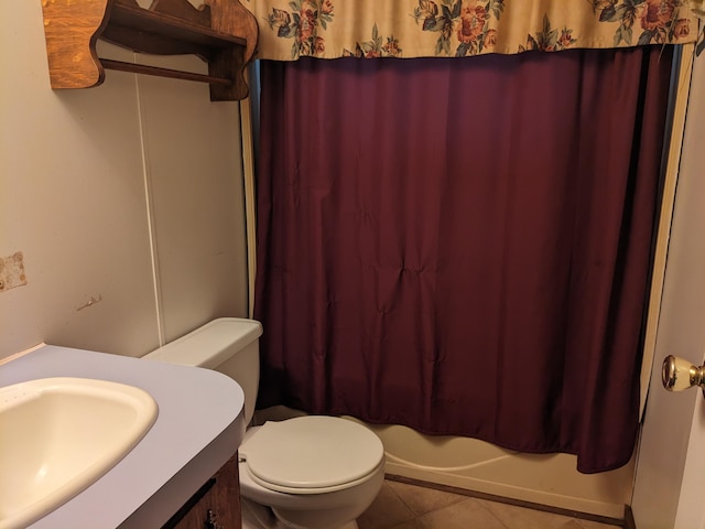 full bathroom featuring shower / bath combo with shower curtain, tile patterned flooring, vanity, and toilet