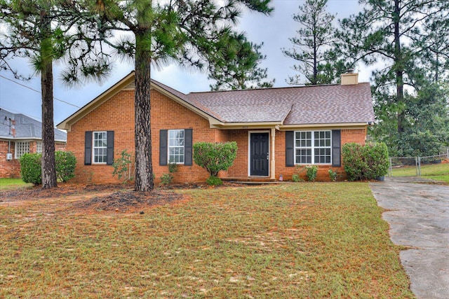 ranch-style house with a front lawn