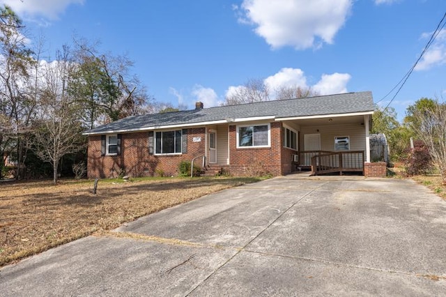 single story home with a carport