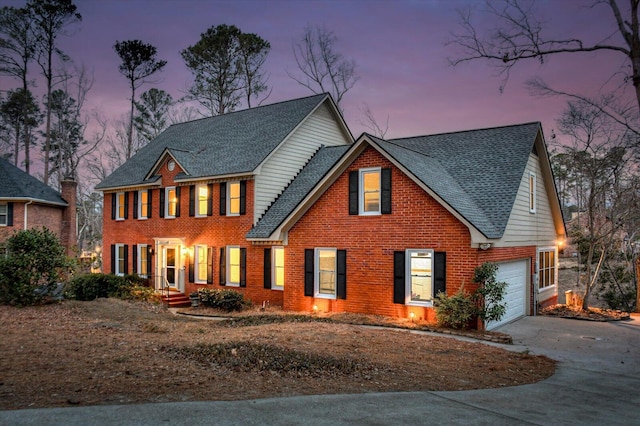 colonial home with a garage