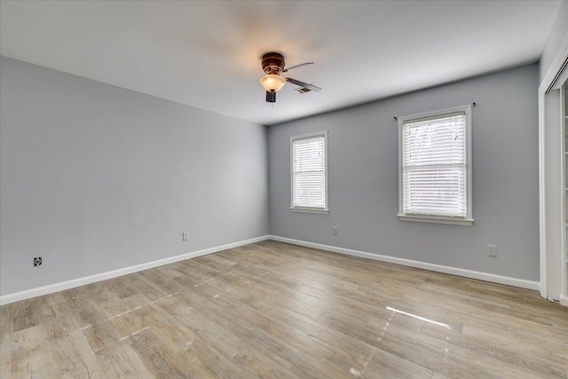 unfurnished room featuring light hardwood / wood-style flooring and ceiling fan