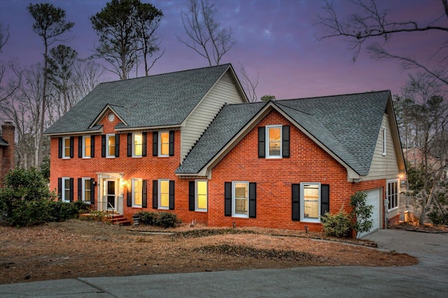 colonial house featuring a garage