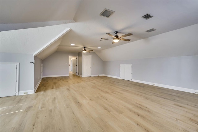 additional living space with ceiling fan, lofted ceiling, and light hardwood / wood-style floors