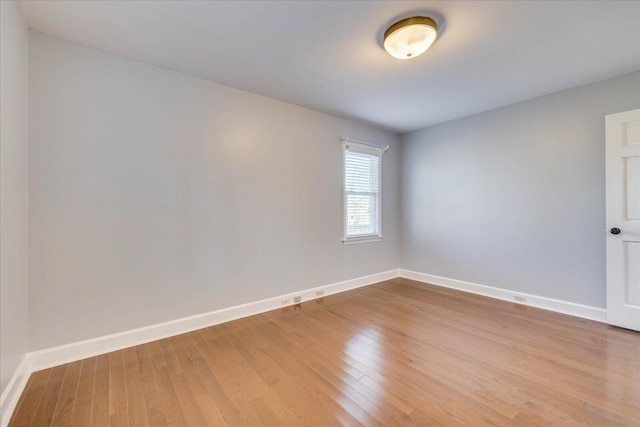 spare room featuring light hardwood / wood-style floors