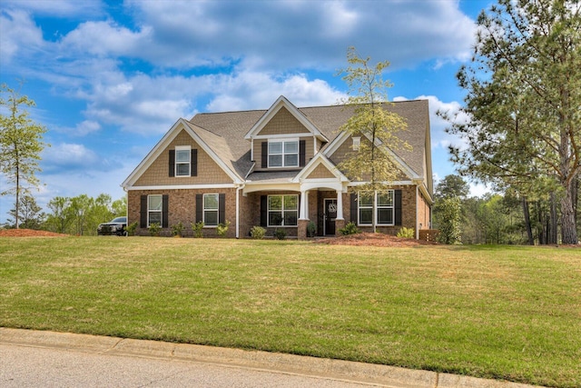 craftsman-style home featuring a front yard