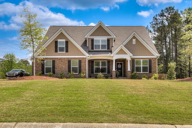 craftsman house with a front lawn