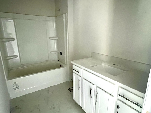 bathroom featuring shower / bathtub combination, marble finish floor, and vanity