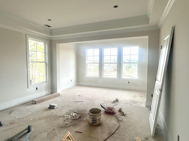 unfurnished room with crown molding, visible vents, and a healthy amount of sunlight