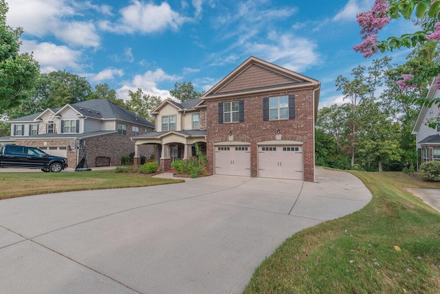 view of front of house with a garage and a front lawn