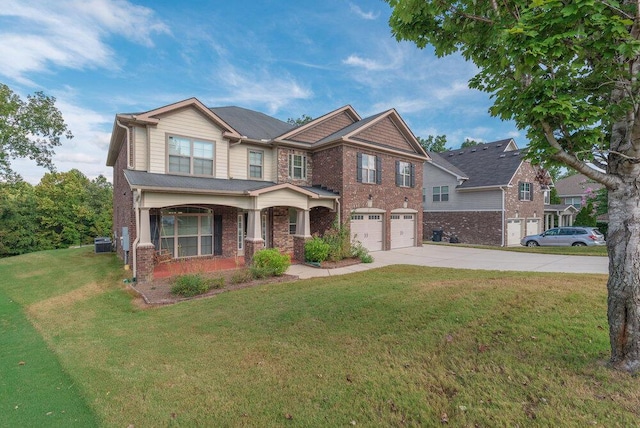 craftsman house featuring central AC, a front yard, and a garage