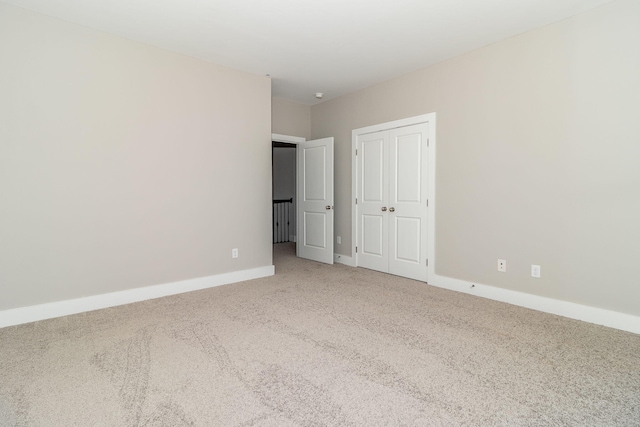 unfurnished bedroom with carpet flooring