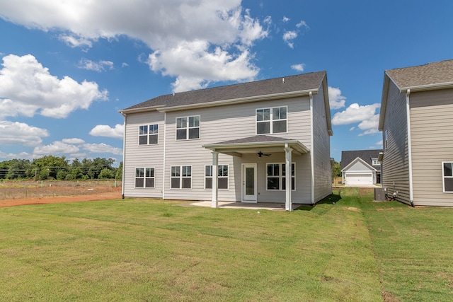 back of house with ceiling fan, a patio area, a yard, and central AC