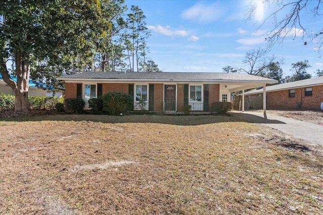 ranch-style house featuring a carport