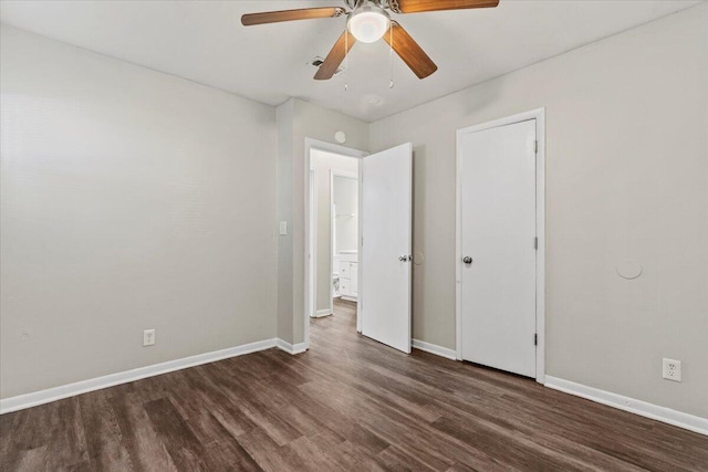 unfurnished bedroom with ceiling fan and dark hardwood / wood-style flooring