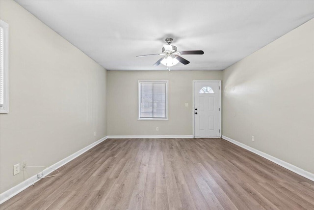 foyer entrance featuring light wood-type flooring and ceiling fan