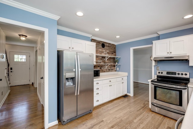 3103 Holly Haven Dr, Augusta, GA 30907 - kitchen with appliances with stainless steel finishes, under cabinet range hood, light wood finished floors, white cabinetry, and ornamental molding