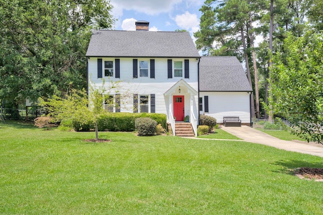 3103 Holly Haven Dr, Augusta, GA 30907 - colonial house featuring a chimney, roof with shingles, and driveway