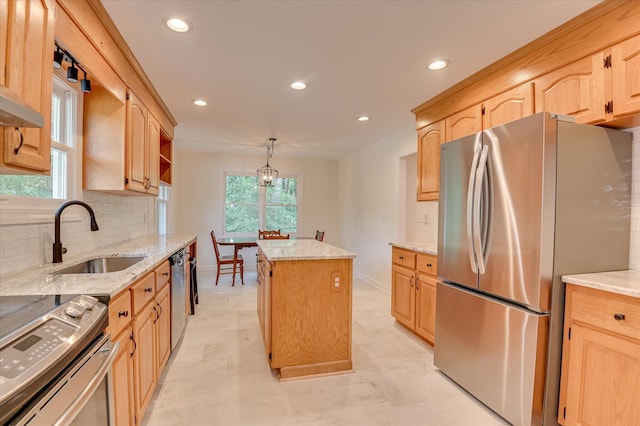 301 Misty Cv, Mccormick, SC 29835 - kitchen with appliances with stainless steel finishes, light brown cabinetry, a kitchen island, decorative backsplash, and recessed lighting