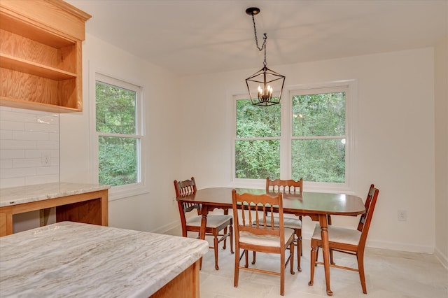 301 Misty Cv, Mccormick, SC 29835 - dining room featuring a chandelier and baseboards