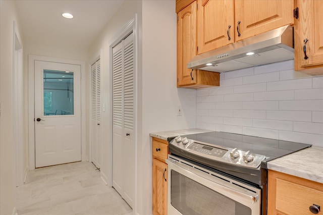 301 Misty Cv, Mccormick, SC 29835 - kitchen with stainless steel electric range, under cabinet range hood, backsplash, recessed lighting, and light brown cabinets